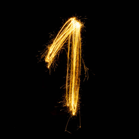 Sparkler firework light alphabet number 1  isolated on black background.の写真素材