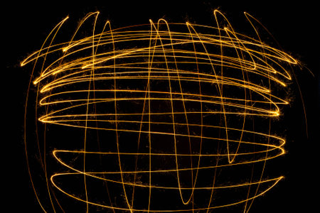 Sparkler firework light on black background. Abstract background.