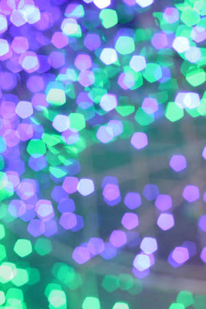 Colorful defocused bokeh lights background. Festive background with natural bokeh.