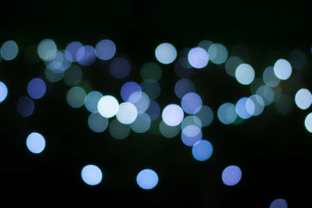 Colorful defocused bokeh lights background. Festive background with natural bokeh. Abstract blur...