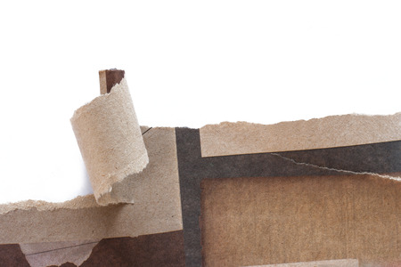 Recycled paper was torn a strip with white background.の写真素材