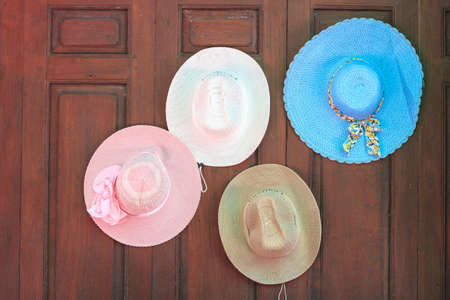 Colorful hat hanging on the wall.
