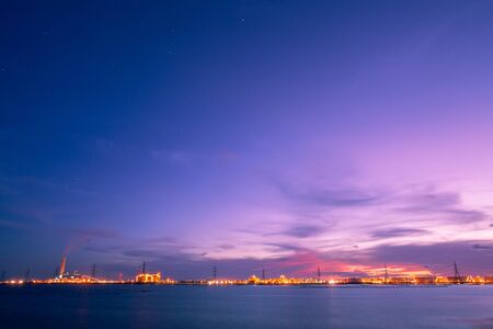 power plant and tank farm at twilightの写真素材