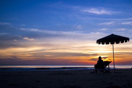 people in silhouette and relaxing sunsetの写真素材