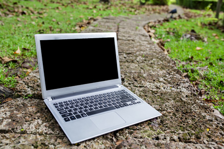 Laptop putting on the walkway 