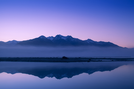 New Zealand mountain peak and snow in morning twilight.の写真素材