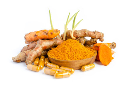 Organic curcumin or turmeric powder, capsule, and fresh root on white background, for health care or alternative treatment conceptの写真素材