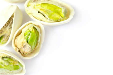 Closed up peeled roasted pistachio nut on white background. For healthy food ingredient or agricultural product conceptの写真素材