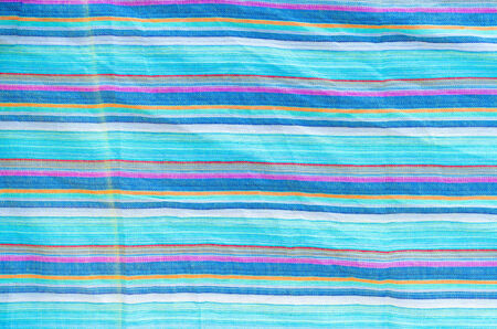 Colorful line patterned fabrics blue green violet yellow texture backgroundの写真素材