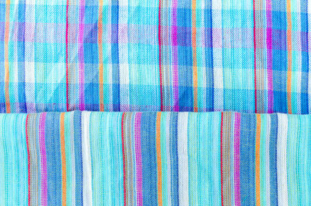 Colorful line patterned fabrics blue green violet yellow texture backgroundの写真素材