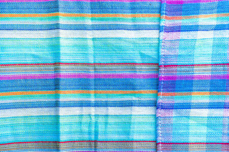 Colorful line patterned fabrics blue green violet yellow texture backgroundの写真素材