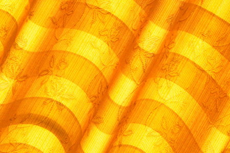 Warm tone blinds or curtains and abstract natural sunlight .の写真素材
