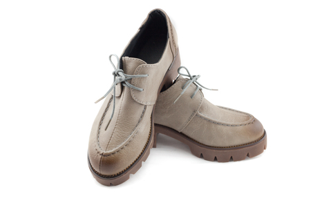 lady leather shoes with shoelace gradient bown on white background.の写真素材