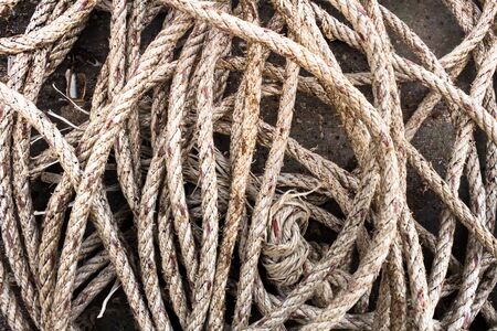 Old rope on the fishing port .