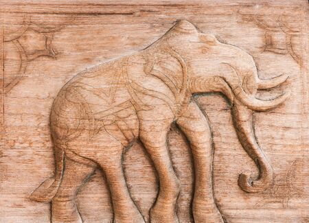 Carved Thai of elephant on the wood.の写真素材