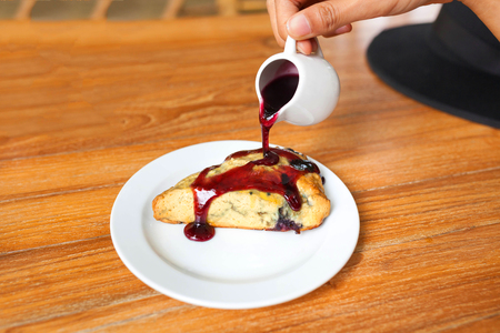 Tasty pie with raspberry jam on wood table.の写真素材