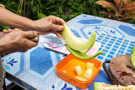 Melon on the table or Cantaloupe salad. Slices of melon on a table.の写真素材