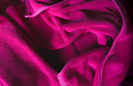 Crumpled purple fabric textile texture background.の写真素材