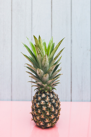 Pineapple on a blue pastel background .の写真素材