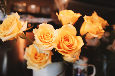 Roses on table in vase retro style.の写真素材