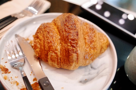 Fresh Croissants on table in morning.