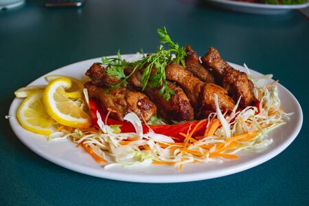 Deep fried chicken wing herb with lemon slide.の写真素材