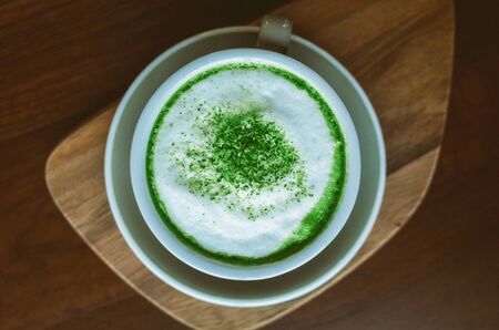 Drink with powdered cup of matcha green tea