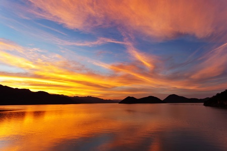 sunset at lake of dam in Thailandの写真素材