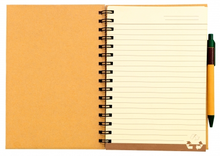 Recycle paper notebook first page on white background with recycle paper penの写真素材