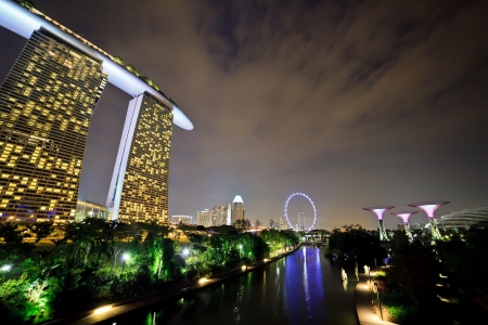 SINGAPORE - APRIL 14 : Nightscape of The Supertree at Gardens by the Bay, Marina Bay Sand and Singapore Flyer on April 14, 2013 Singapore. There are the main tourist attraction of Singapore City.のeditorial素材