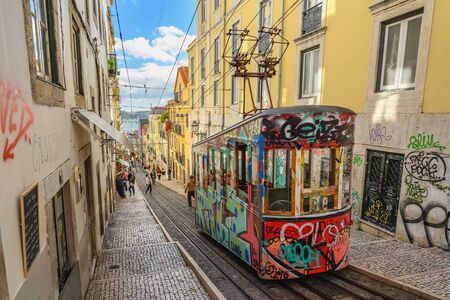 LISBON, PORTUGAL - APRIL 10, 2019: Lisbon Portugal city skyline at Chiado district and Lisbon Tramのeditorial素材