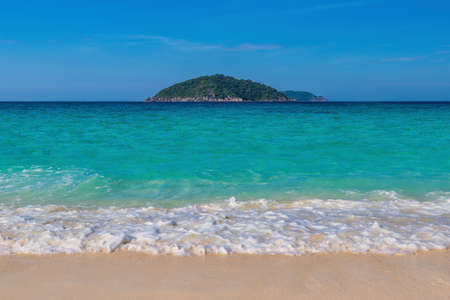 Tropical islands view of ocean blue sea wave water and white sand beach, nature landscape in Thailandの写真素材