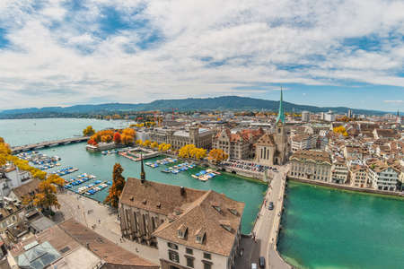 Zurich Switzerland, high angle view city skyline from Grossmunster with autumn foliage seasonの写真素材