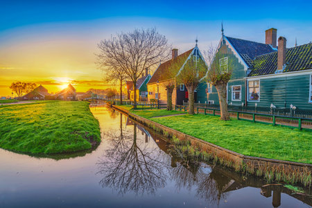 Amsterdam Netherlands, Sunrise landscape of Dutch Windmill and traditional house at Zaanse Schans Villageの写真素材