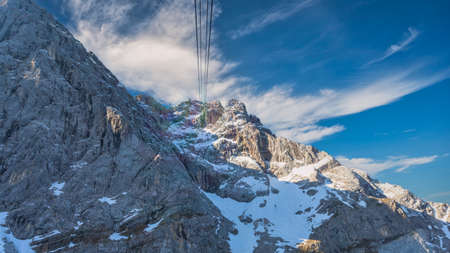 Garmisch Partenkirchen Germany, Zugspitze peak and Alps mountain range with Eibsee cable carの写真素材