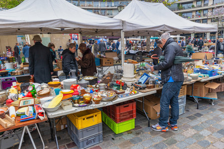 Paris, France - May 4, 2017: people looking for goods in antique second hand shop at Aligre Market in Parisのeditorial素材