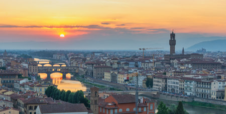 Florence Italy, panorama high angle view sunset city skyline at Ponte Vecchio Bridge and Arno River, Tuscany Italyの写真素材