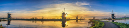 Rotterdam Netherlands, sunrise panorama nature landscape of Dutch Windmill at Kinderdijk Villageの写真素材