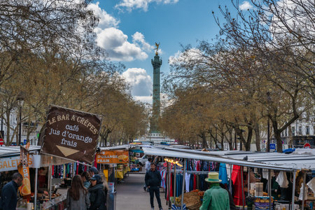 Paris, France - April 4, 2019: city skyline at Place de la Bastille market with many shop and touristのeditorial素材