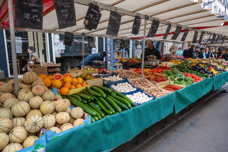 Paris, France - May 14, 2023: many tourist walking and shopping at Aligre Market in Parisのeditorial素材
