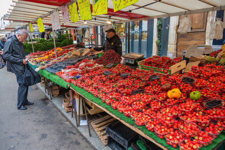 Paris, France - May 14, 2023: many tourist walking and shopping at Aligre Market in Parisのeditorial素材