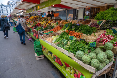 Paris, France - May 14, 2023: many tourist walking and shopping at Aligre Market in Parisのeditorial素材