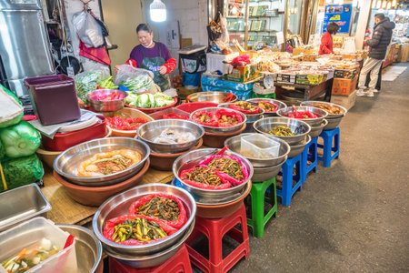 Seoul, South Korea - November 11, 2022 : food and ingredient shop with many tourist at Gwangjang Marketのeditorial素材