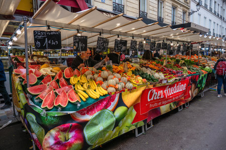 Paris, France - May 14, 2023: many tourist walking and shopping at Aligre Market in Parisのeditorial素材
