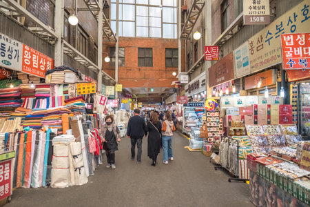 Seoul, South Korea - November 11, 2022 : food and ingredient shop with many tourist at Gwangjang Marketのeditorial素材