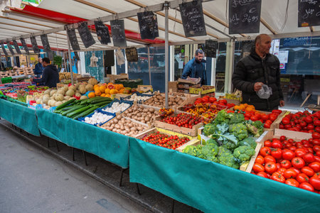 Paris, France - May 14, 2023: many tourist walking and shopping at Aligre Market in Parisのeditorial素材