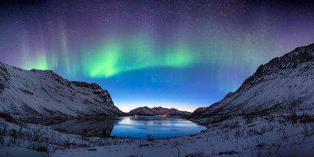 Tromso Norway aurora borealis northern lights panorama winter landscape at Grotfjordの写真素材