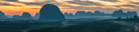 Mountain sunrise view at Din Deang Doi viewpoint with tropical forest, Krabi Thailand nature landscape panoramaの写真素材