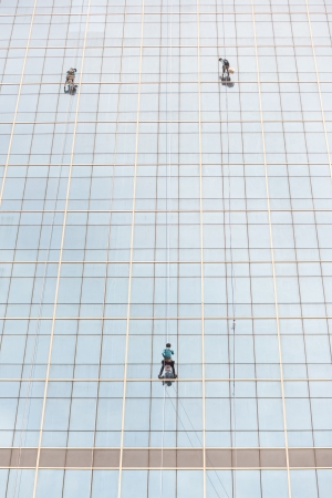 worker cleaning high towerのeditorial素材