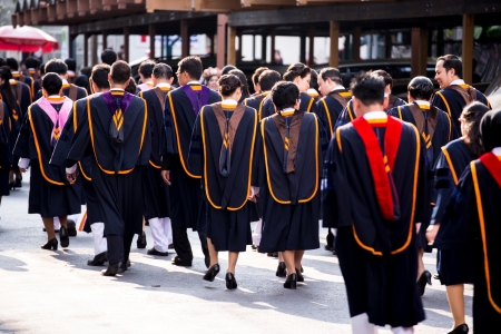 BANGKOK - March 1, 2012  Bangkok, Thailand  graduates of the Ramkumheang University walk towards Convocation Hall to receive their diplomas on March 1, 2013 のeditorial素材